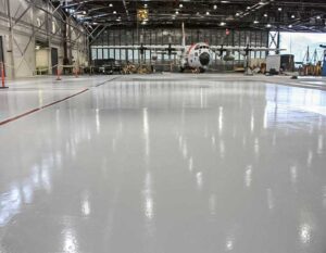 Airplane hangar with epoxy floor coating